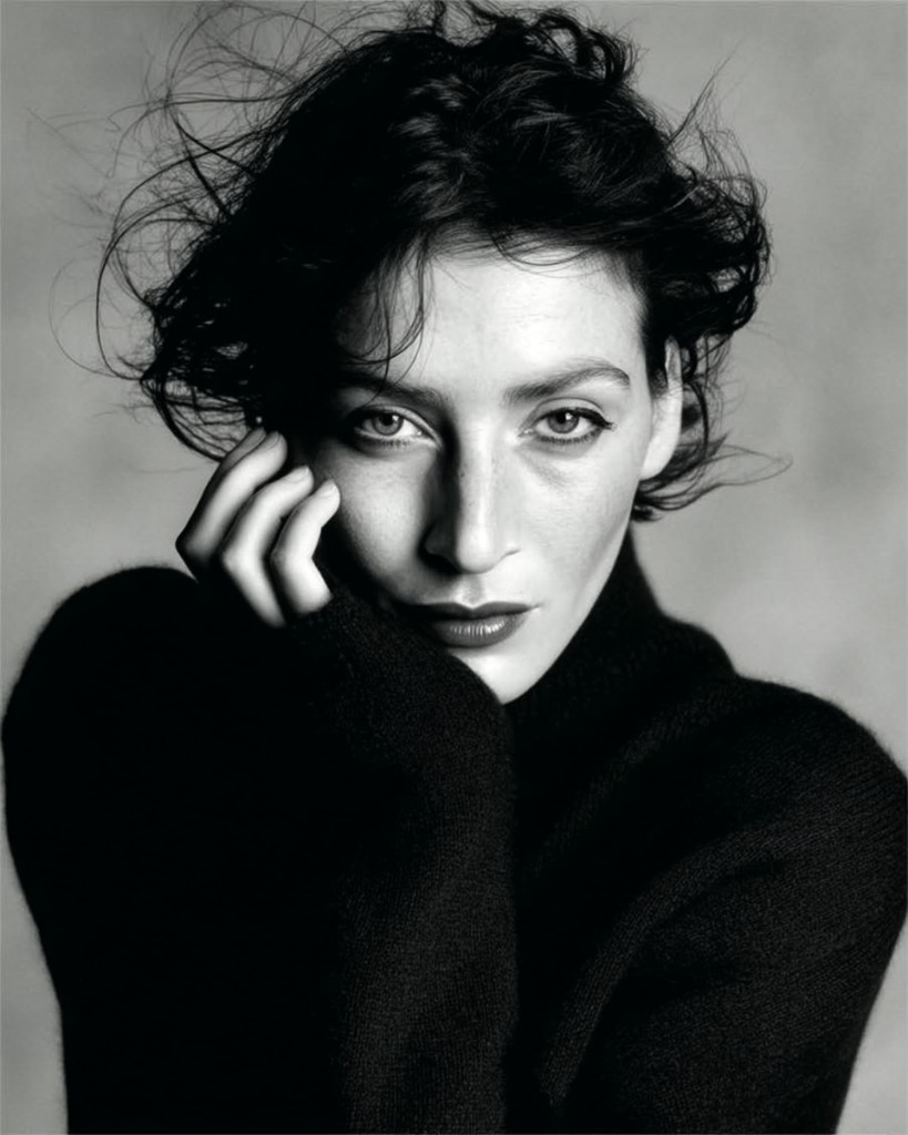 Professional black and white editorial portrait of Olga Vasilevsky in a black turtleneck, Parisian-inspired styling.